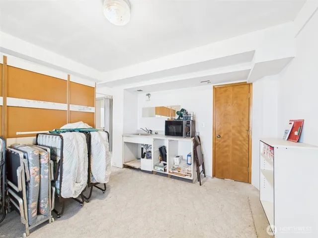 a bedroom with two beds and a window