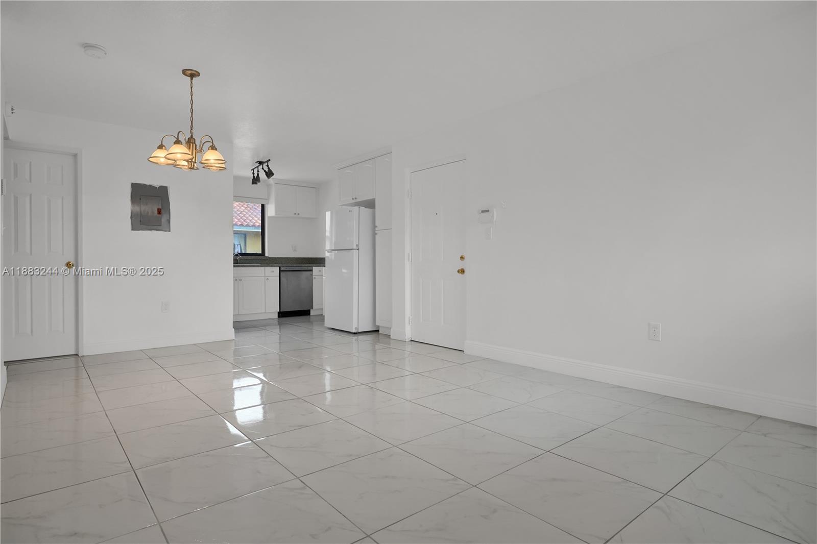 2740 West 61st Street, Unit 204 Hialeah, FL 33016 - Photo 12 of 20 a view of a kitchen with a sink and a window