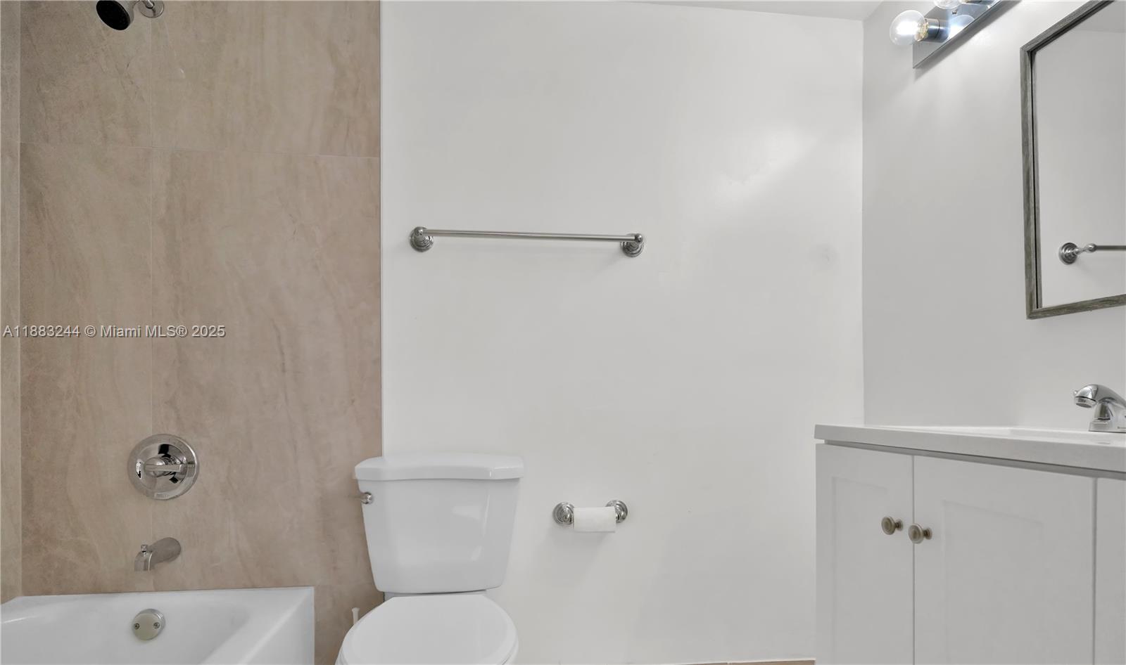 2740 West 61st Street, Unit 204 Hialeah, FL 33016 - Photo 6 of 20 a white toilet sitting next to a bath tub