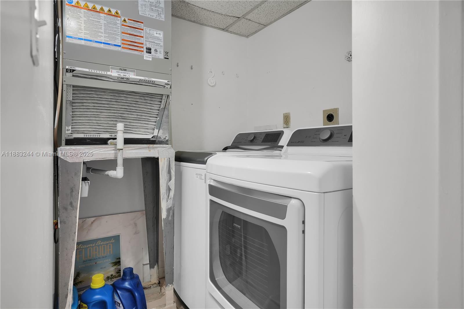 2740 West 61st Street, Unit 204 Hialeah, FL 33016 - Photo 9 of 20 a utility room with dryer and washer