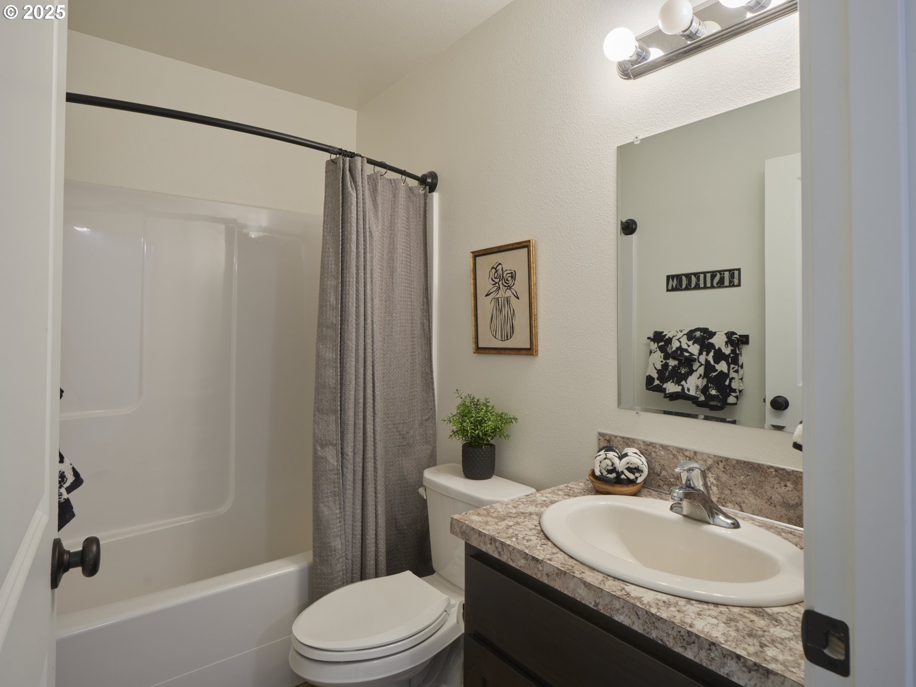 780 Frost Road Winlock, WA 98596 - Photo 19 of 40 a bathroom with a granite countertop sink toilet and shower