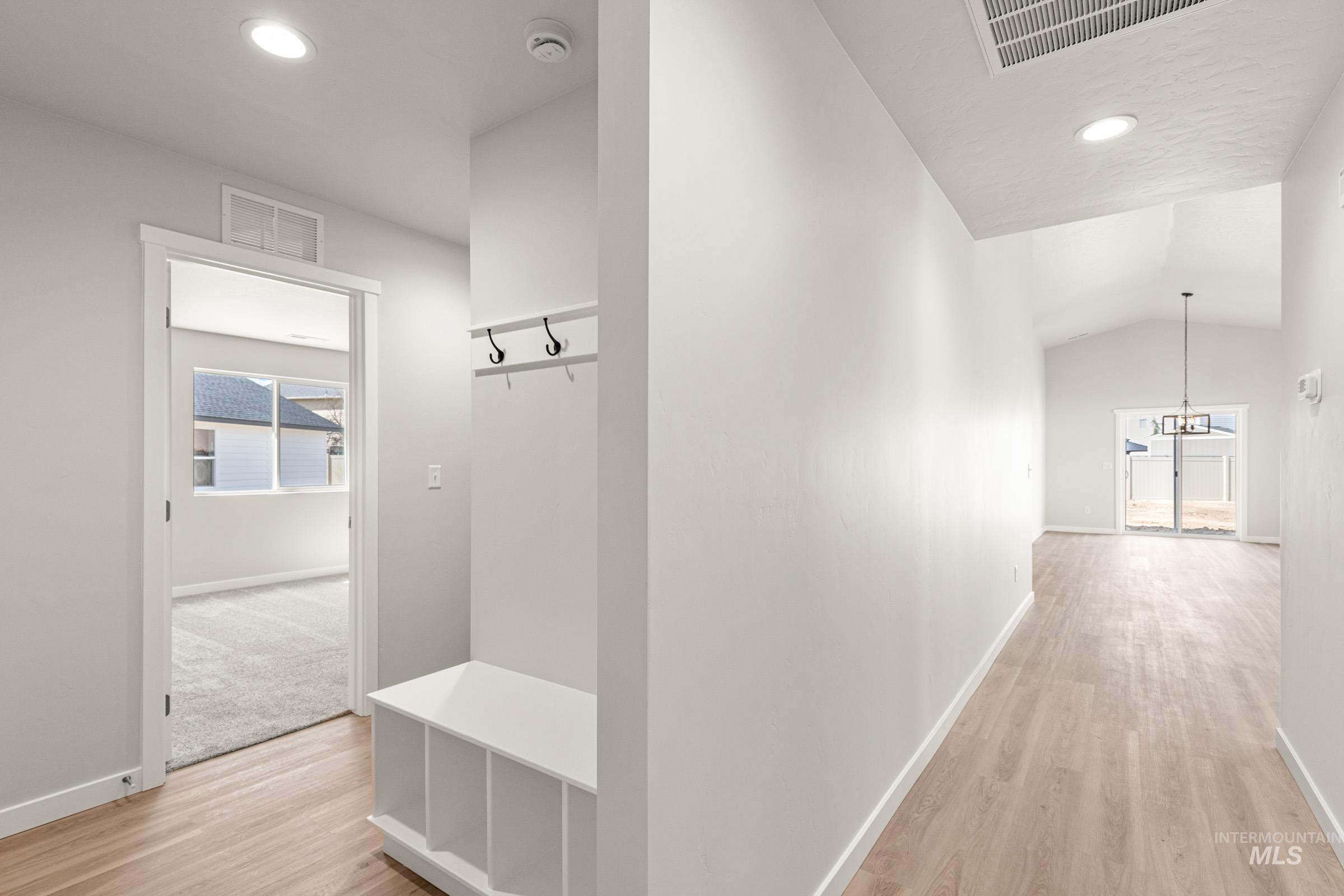 13728 Redway Court Caldwell, ID 83607 - Photo 10 of 19 Mudroom featuring recessed lighting, light wood-style floors, and lofted ceiling