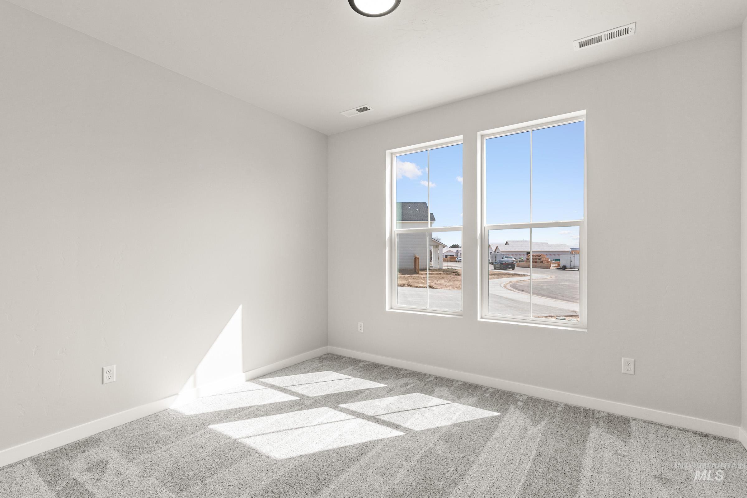 13728 Redway Court Caldwell, ID 83607 - Photo 11 of 19 Empty room with baseboards and light carpet