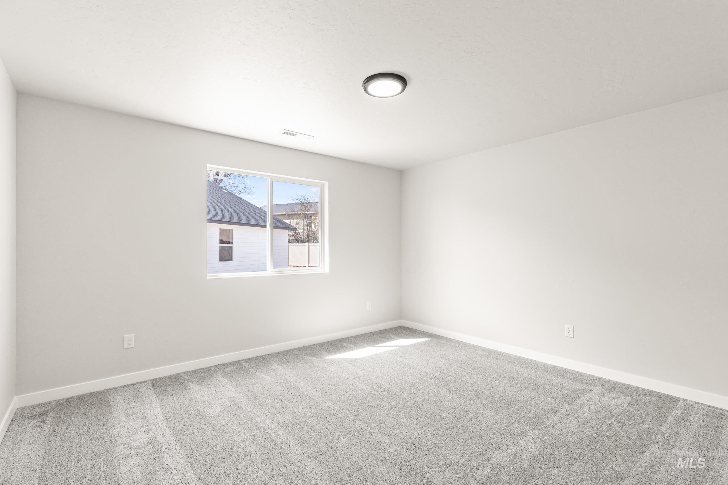 13728 Redway Court Caldwell, ID 83607 - Photo 14 of 19 Unfurnished room with light carpet and baseboards