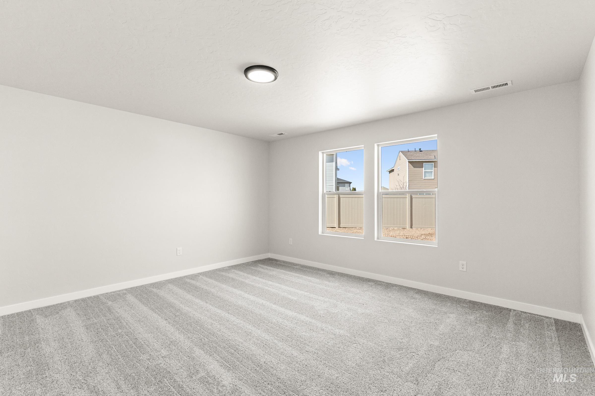 13728 Redway Court Caldwell, ID 83607 - Photo 16 of 19 Spare room featuring light carpet and baseboards