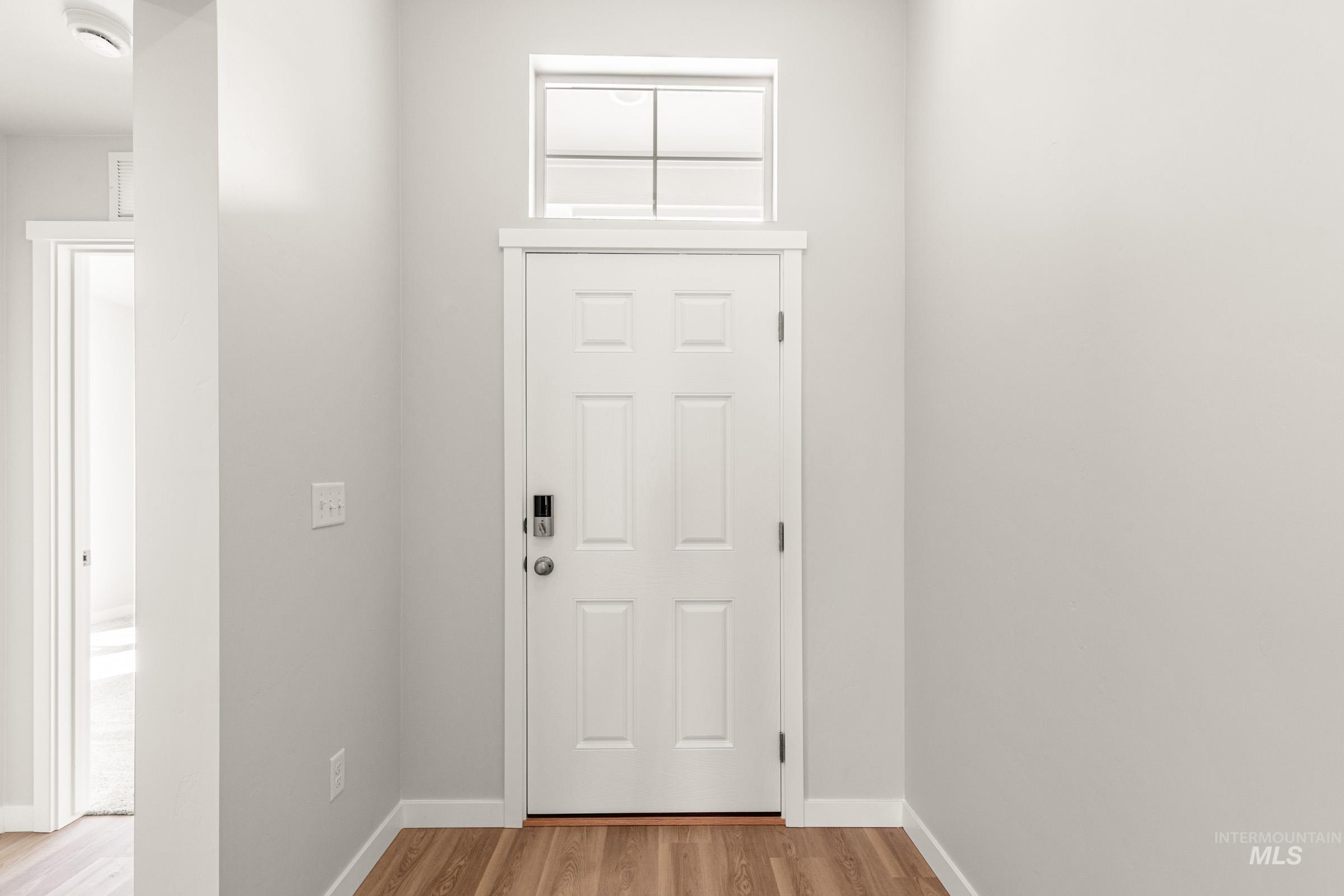 13728 Redway Court Caldwell, ID 83607 - Photo 2 of 19 Foyer with light wood finished floors and baseboards