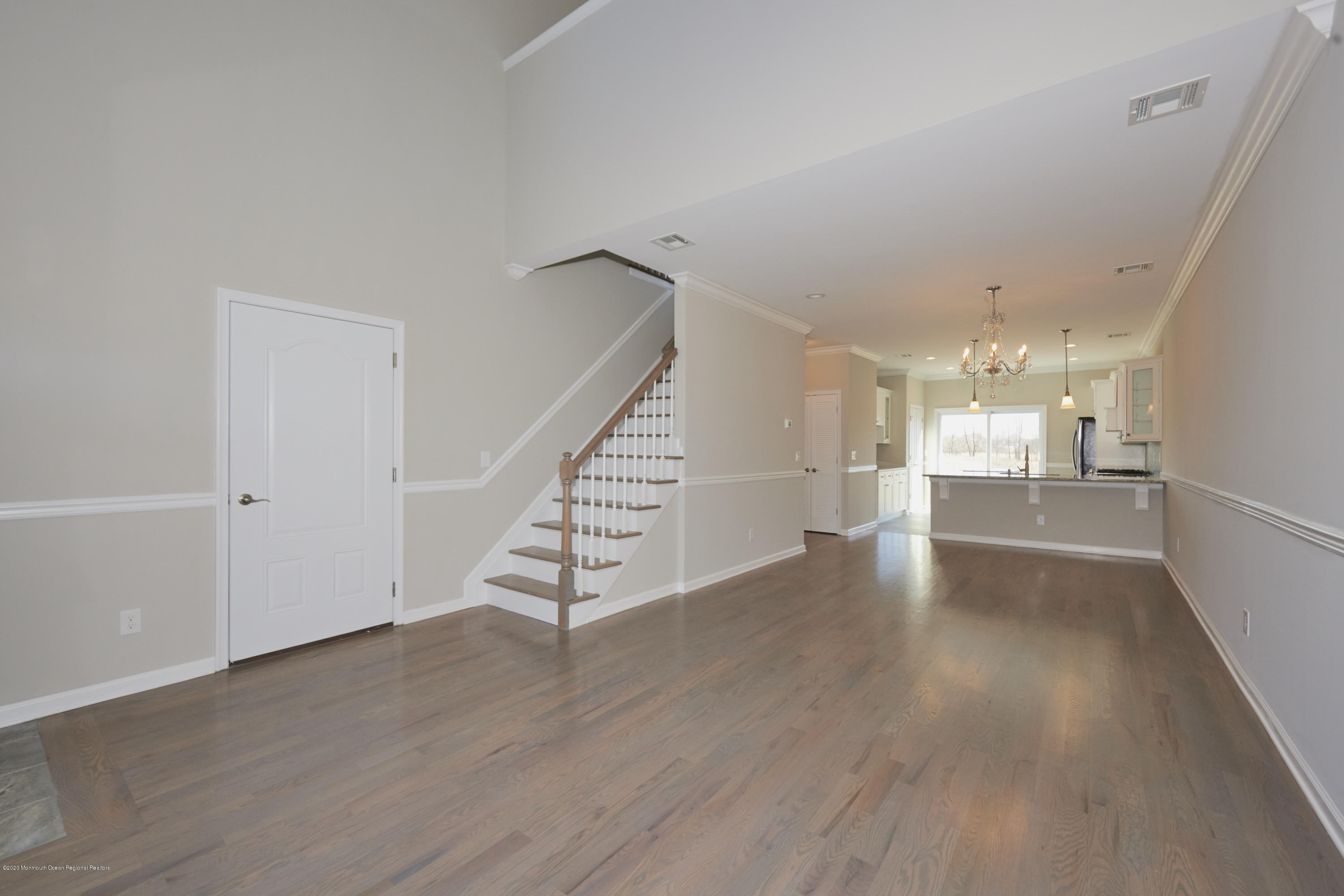 23 Green Tree Circle Hazlet, NJ 07730 - Photo 13 of 38 a view of a hallway with wooden floor and kitchen