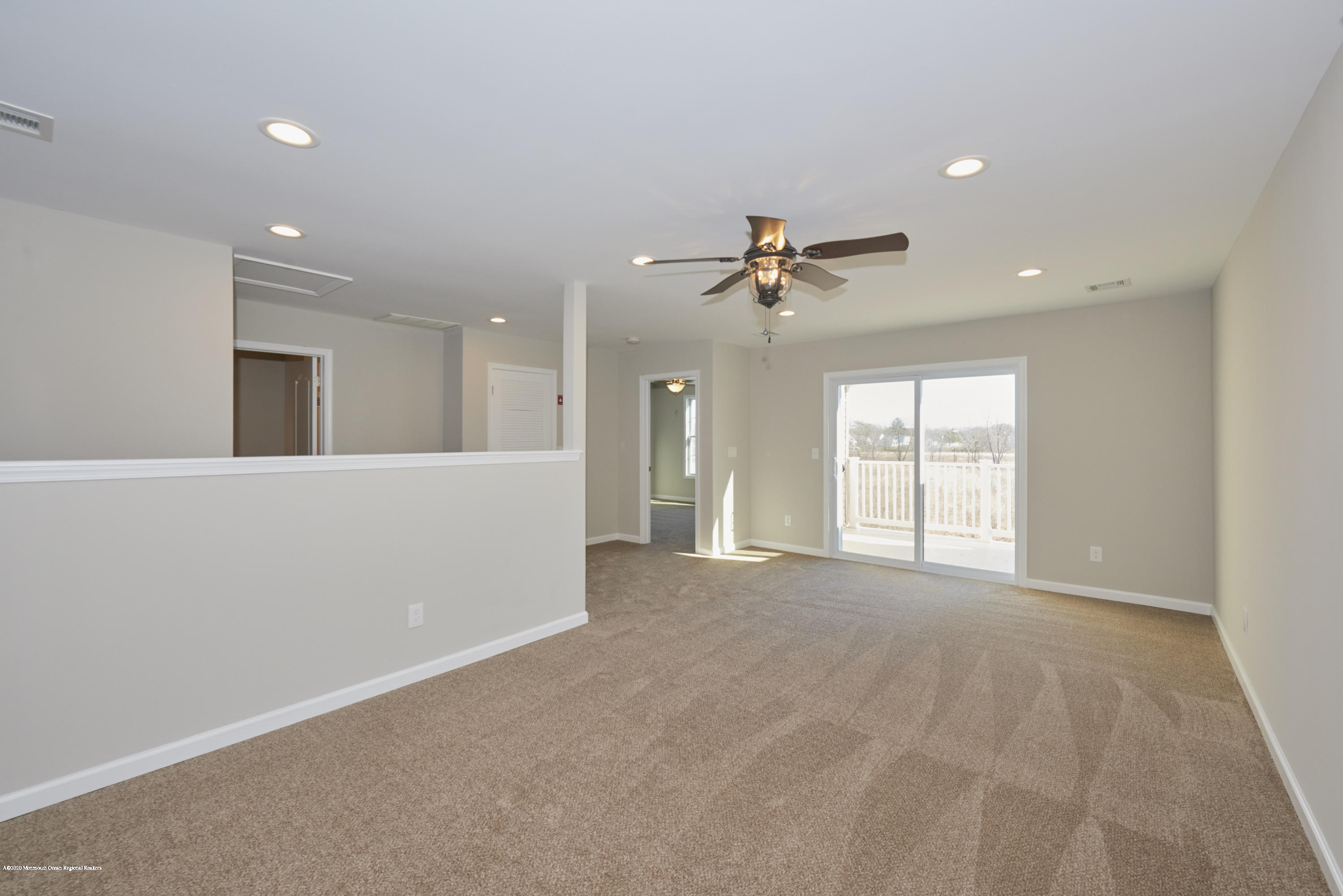 23 Green Tree Circle Hazlet, NJ 07730 - Photo 23 of 38 a view of an empty room with a window