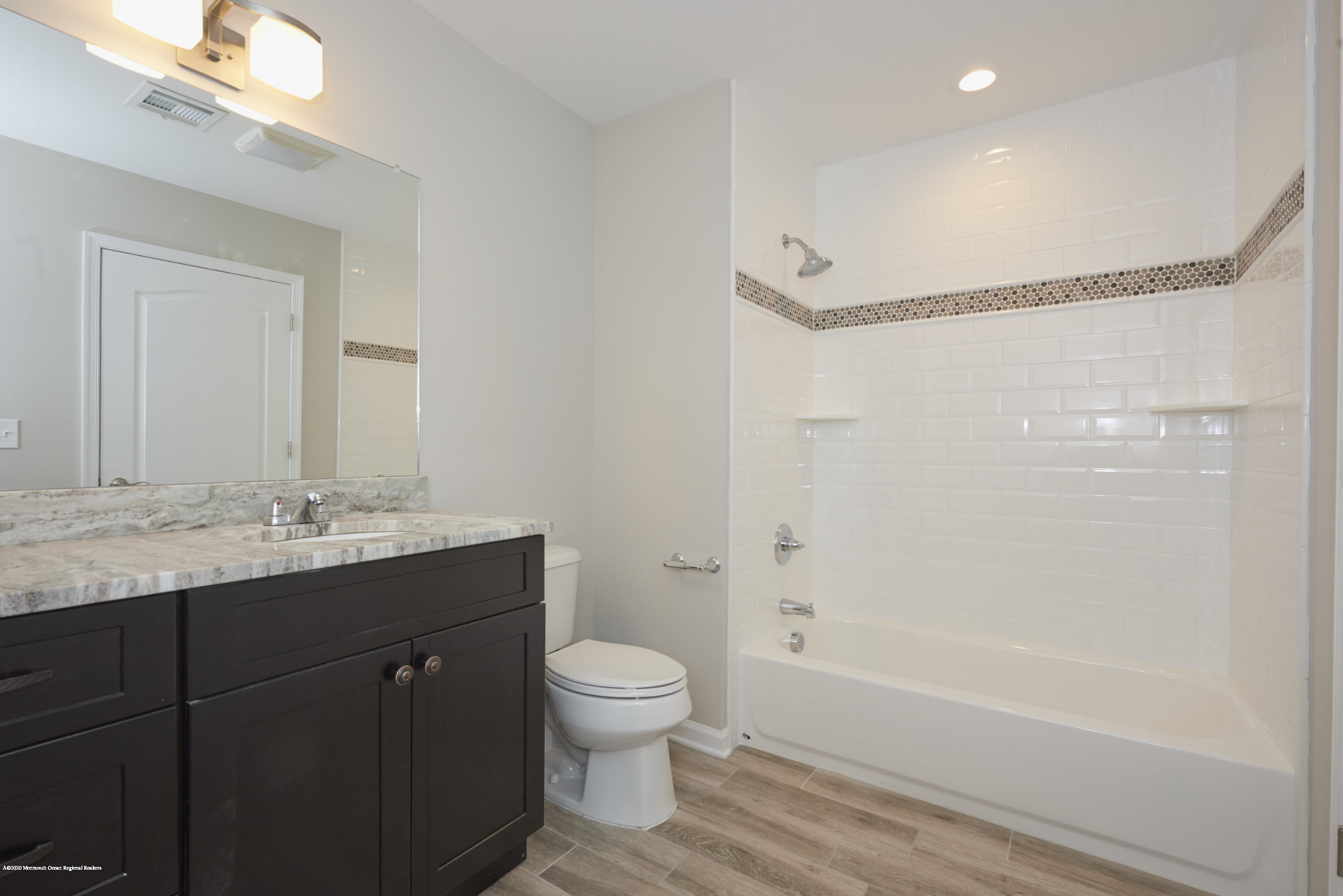 23 Green Tree Circle Hazlet, NJ 07730 - Photo 29 of 38 a bathroom with a granite countertop sink a toilet and shower
