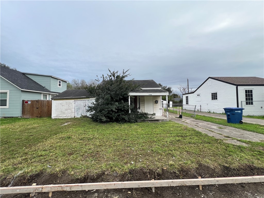 4402 Cottage Street Corpus Christi, TX 78415 - Photo 2 of 10 a front view of a house with garden