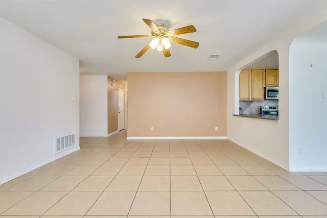 a view of a kitchen with a sink and a window
