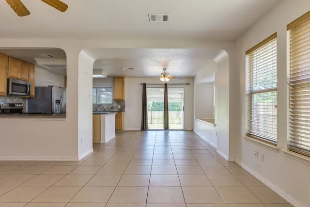 a view of a living room with a large window