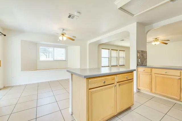 a kitchen with stainless steel appliances granite countertop a sink and a granite counter tops