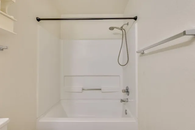 a view of a room with a large window