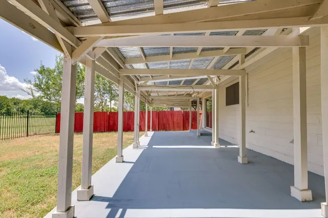a view of a house with a backyard and a garden