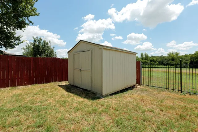 a backyard of a house with lots of green space