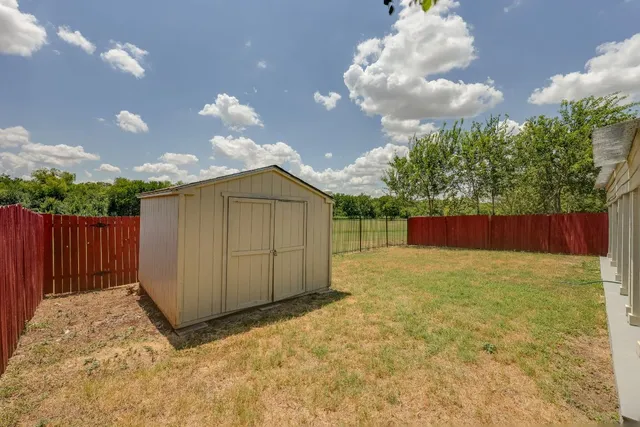a view of a field with an ocean