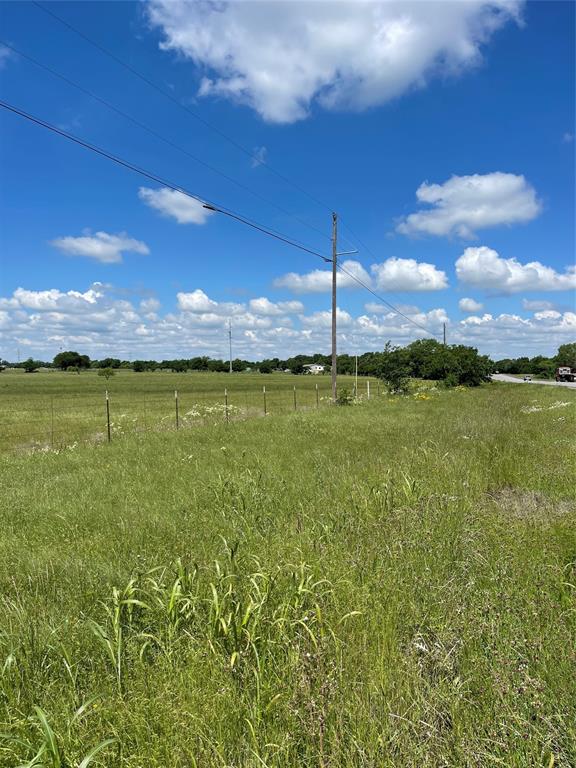 4063 Weatherford Highway Cleburne, TX 76033 - Photo 1 of 10 a view of a lake with a building in the background