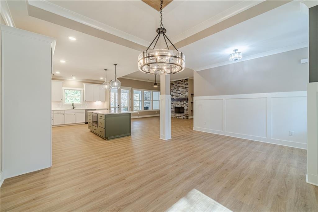 327 Pine Circle Monroe, GA 30655 - Photo 11 of 69 a view of a kitchen with wooden floor and a sink