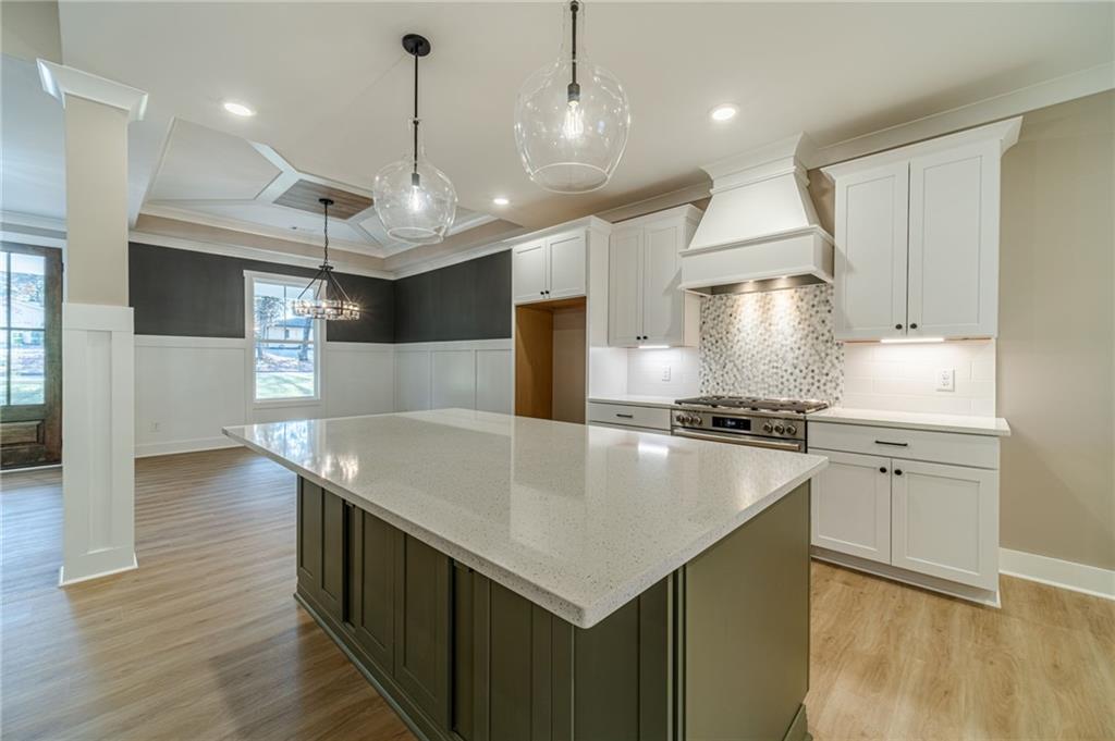 327 Pine Circle Monroe, GA 30655 - Photo 15 of 69 a kitchen with stainless steel appliances granite countertop a sink a oven a stove and a refrigerator