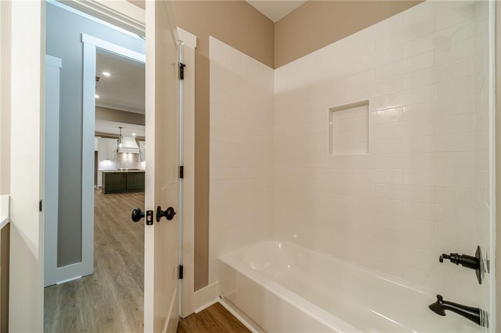 327 Pine Circle Monroe, GA 30655 - Photo 26 of 69 a bathroom with a bathtub