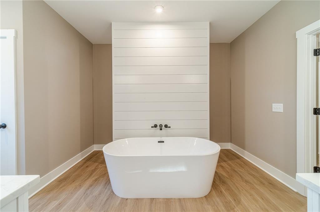 327 Pine Circle Monroe, GA 30655 - Photo 35 of 69 a white bath tub sitting in a bathroom