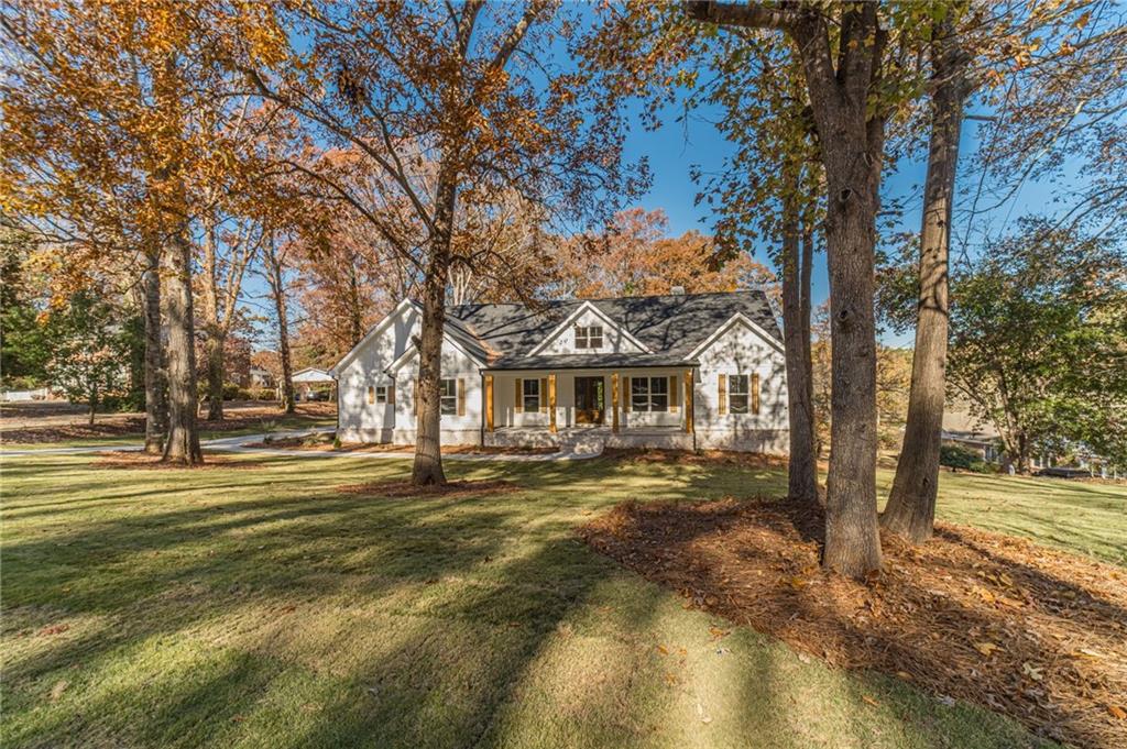 327 Pine Circle Monroe, GA 30655 - Photo 4 of 69 a front view of a house with a yard