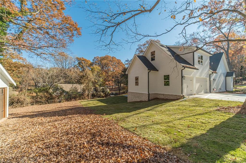 327 Pine Circle Monroe, GA 30655 - Photo 56 of 69 a front view of a house with a yard