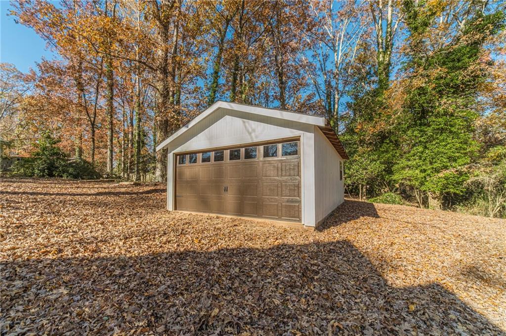 327 Pine Circle Monroe, GA 30655 - Photo 57 of 69 a front view of a house with a yard