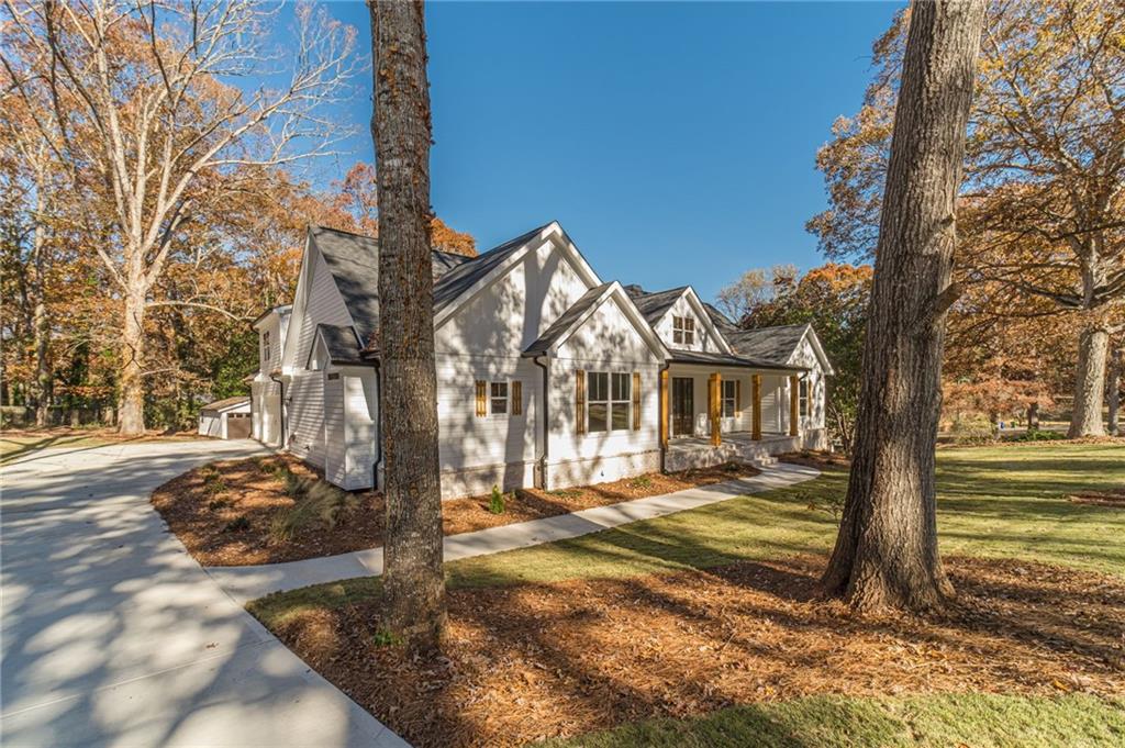 327 Pine Circle Monroe, GA 30655 - Photo 6 of 69 a view of a house with a yard covered in snow