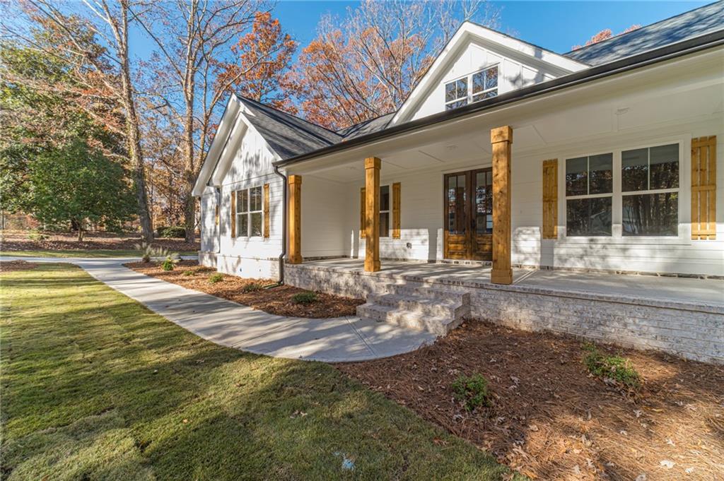 327 Pine Circle Monroe, GA 30655 - Photo 7 of 69 a front view of a house with a yard