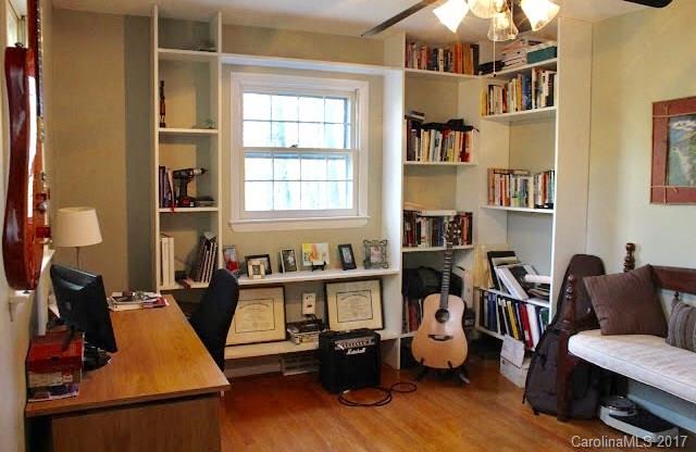 55 Faircrest Road Asheville, NC 28804 - Photo 11 of 20 a room with furniture and a wooden floor
