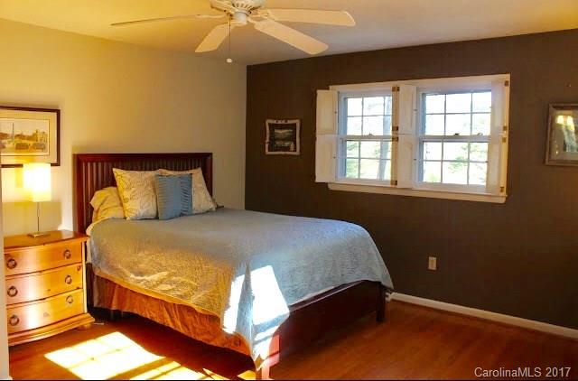 55 Faircrest Road Asheville, NC 28804 - Photo 13 of 20 a bedroom with a bed and window