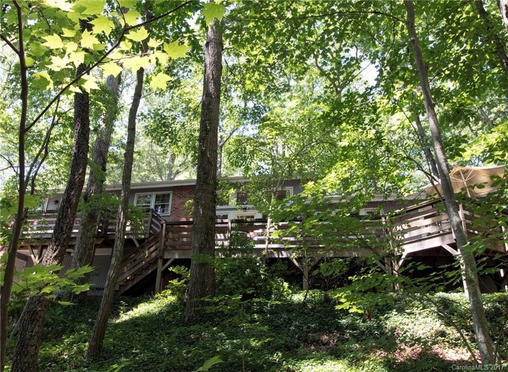 55 Faircrest Road Asheville, NC 28804 - Photo 14 of 20 a backyard of a house with lots of green space and fountain