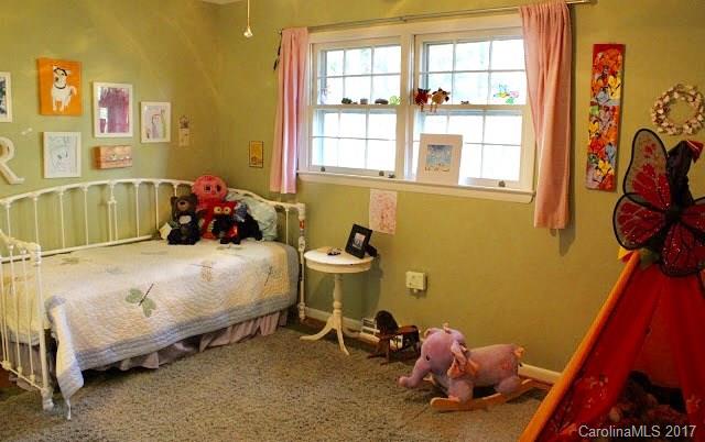 55 Faircrest Road Asheville, NC 28804 - Photo 15 of 20 a bed room with a bed and a window