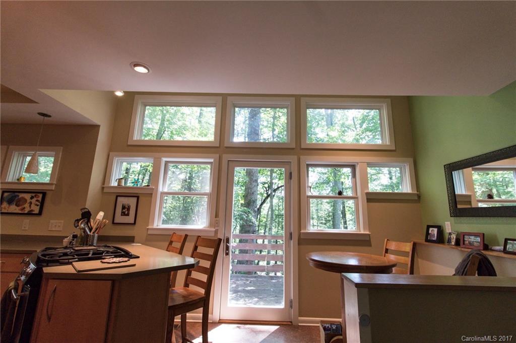 55 Faircrest Road Asheville, NC 28804 - Photo 19 of 20 a view of a dining room with furniture window and outside view