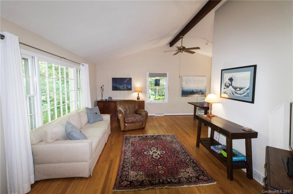 55 Faircrest Road Asheville, NC 28804 - Photo 20 of 20 a living room with furniture and a rug