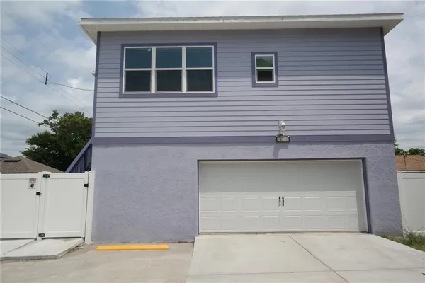 a view of a house with a garage