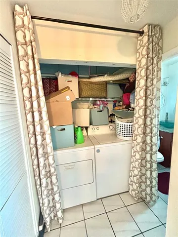a utility room with washer and dryer