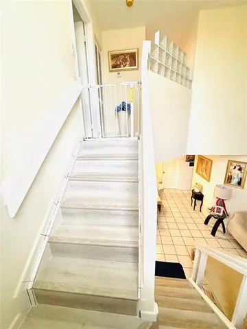 a view of staircase with white walls
