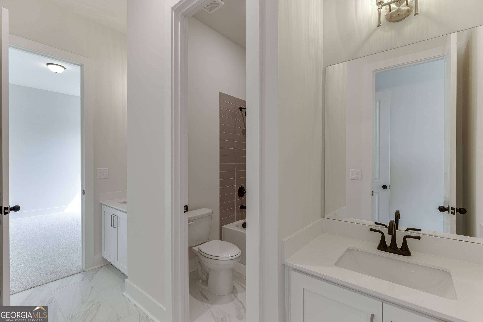 5410 Settingdown Road Cumming, GA 30028 - Photo 20 of 86 a bathroom with a sink a toilet and shower