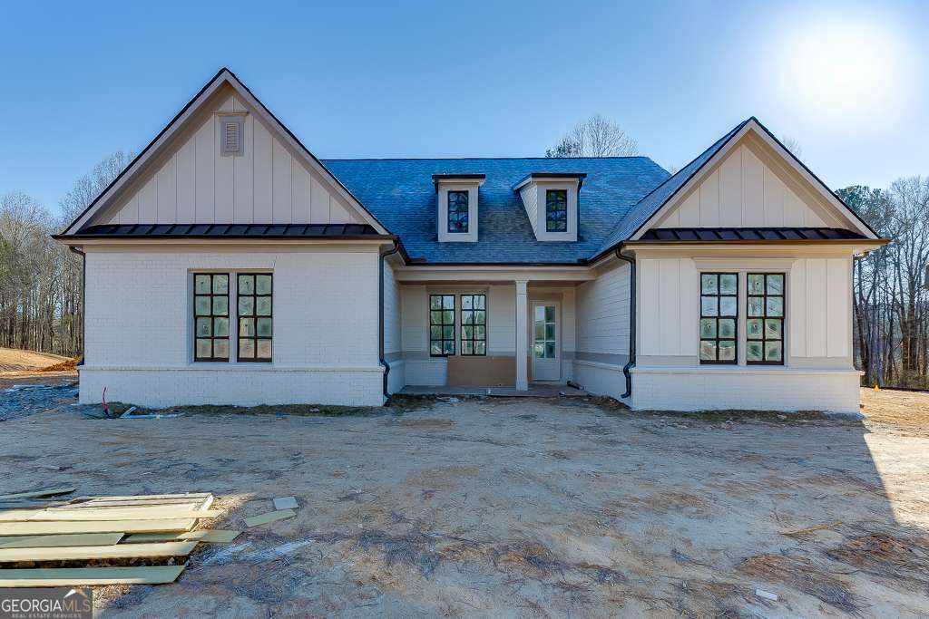 5410 Settingdown Road Cumming, GA 30028 - Photo 3 of 86 a front view of a house with garden