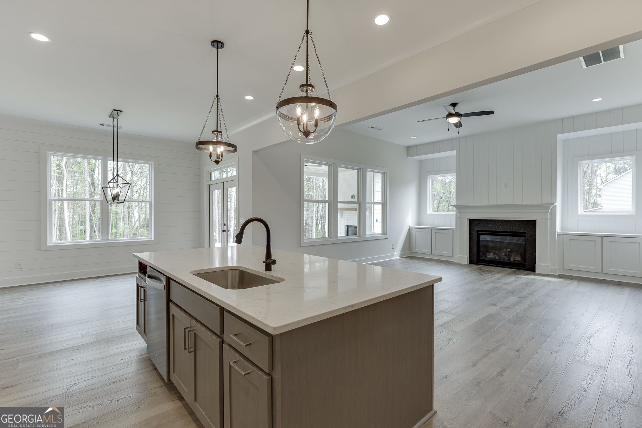 5410 Settingdown Road Cumming, GA 30028 - Photo 42 of 86 a kitchen with sink microwave and wooden floor