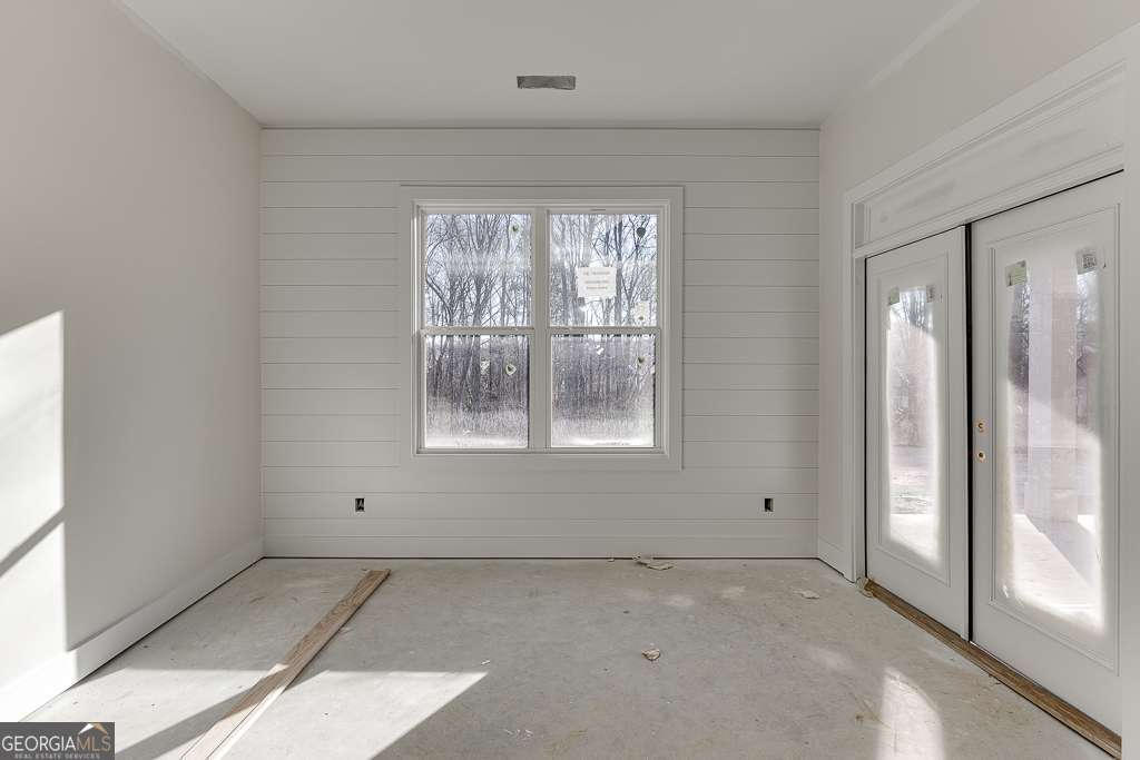 5410 Settingdown Road Cumming, GA 30028 - Photo 45 of 86 an empty room with windows