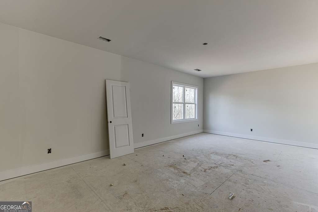 5410 Settingdown Road Cumming, GA 30028 - Photo 67 of 86 a view of an empty room with a window