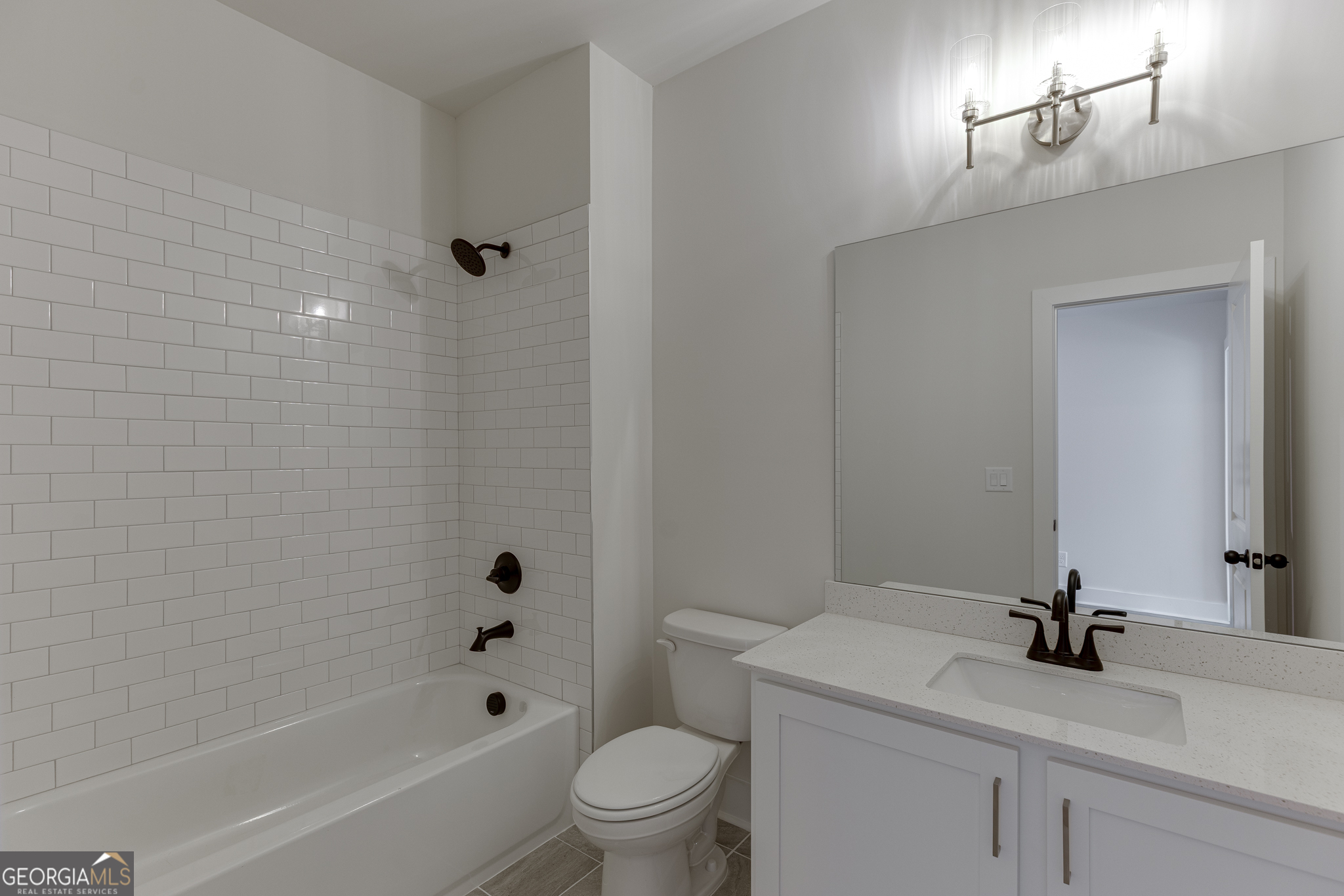 5410 Settingdown Road Cumming, GA 30028 - Photo 76 of 86 a bathroom with a sink a toilet and shower