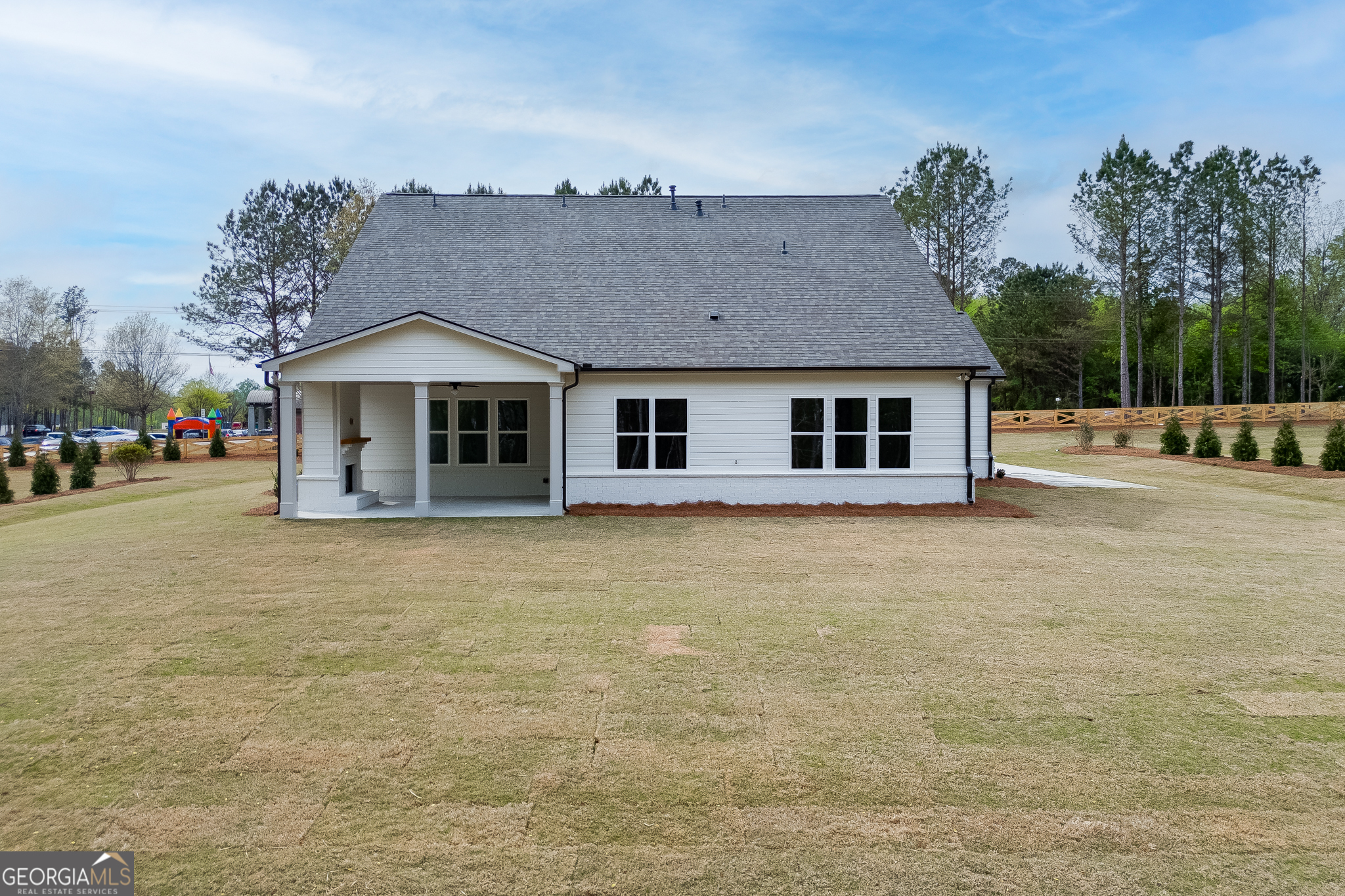 5410 Settingdown Road Cumming, GA 30028 - Photo 82 of 86 a front view of a house with a garden