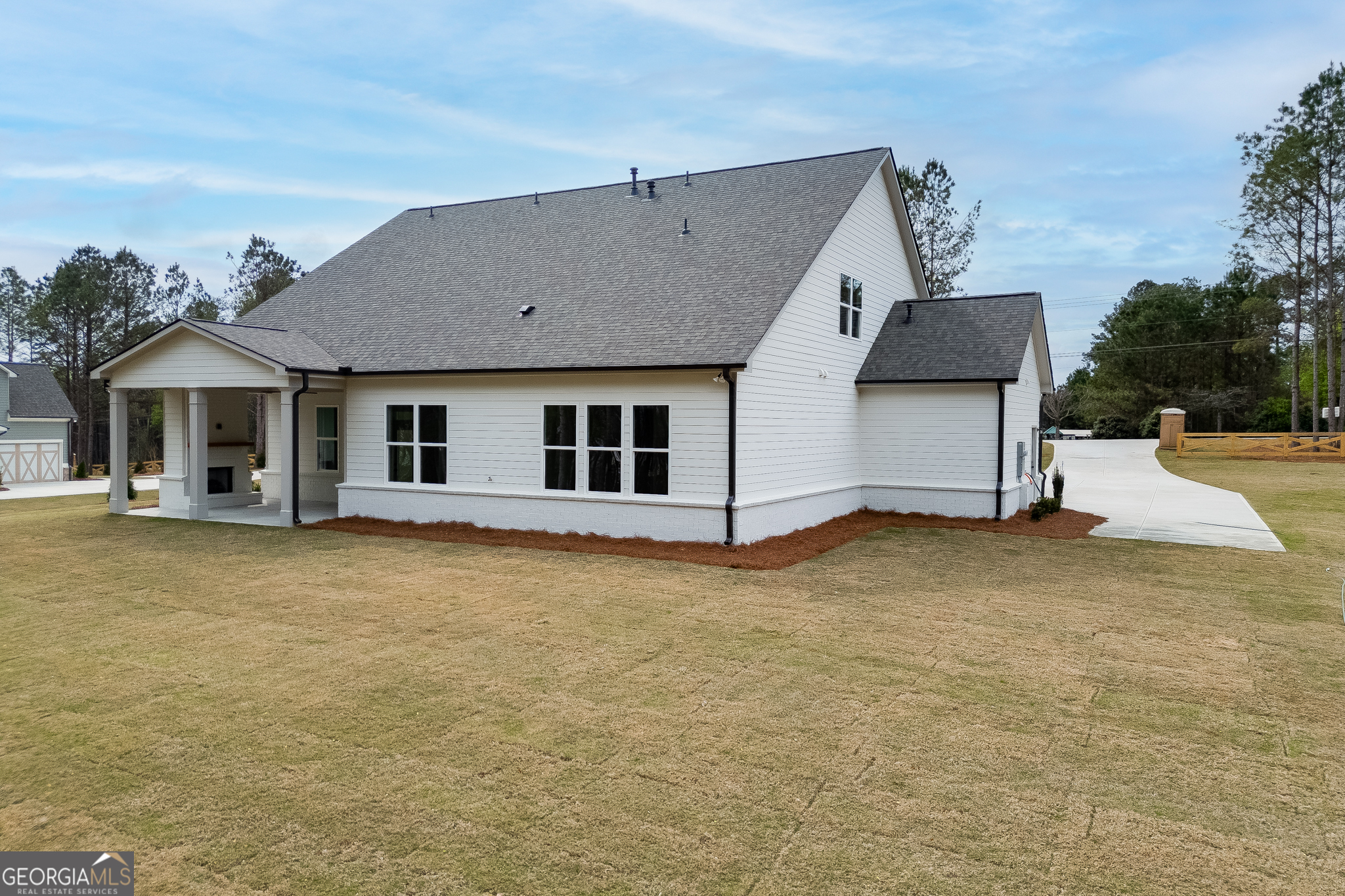 5410 Settingdown Road Cumming, GA 30028 - Photo 83 of 86 a house with trees in front of it