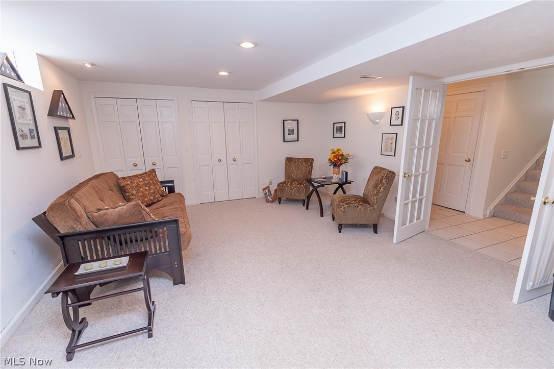 119 Winston Road Akron, OH 44313 - Photo 21 of 28 The basement rec room/office with a lot of storage space in and across the hallway!