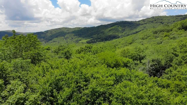 a view of a field with a street sign